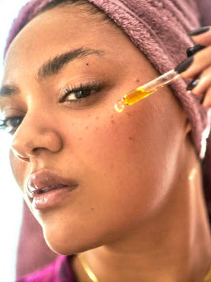Applying Intensive Recovery Face Oil serum to facial skin for hydration and nourishment