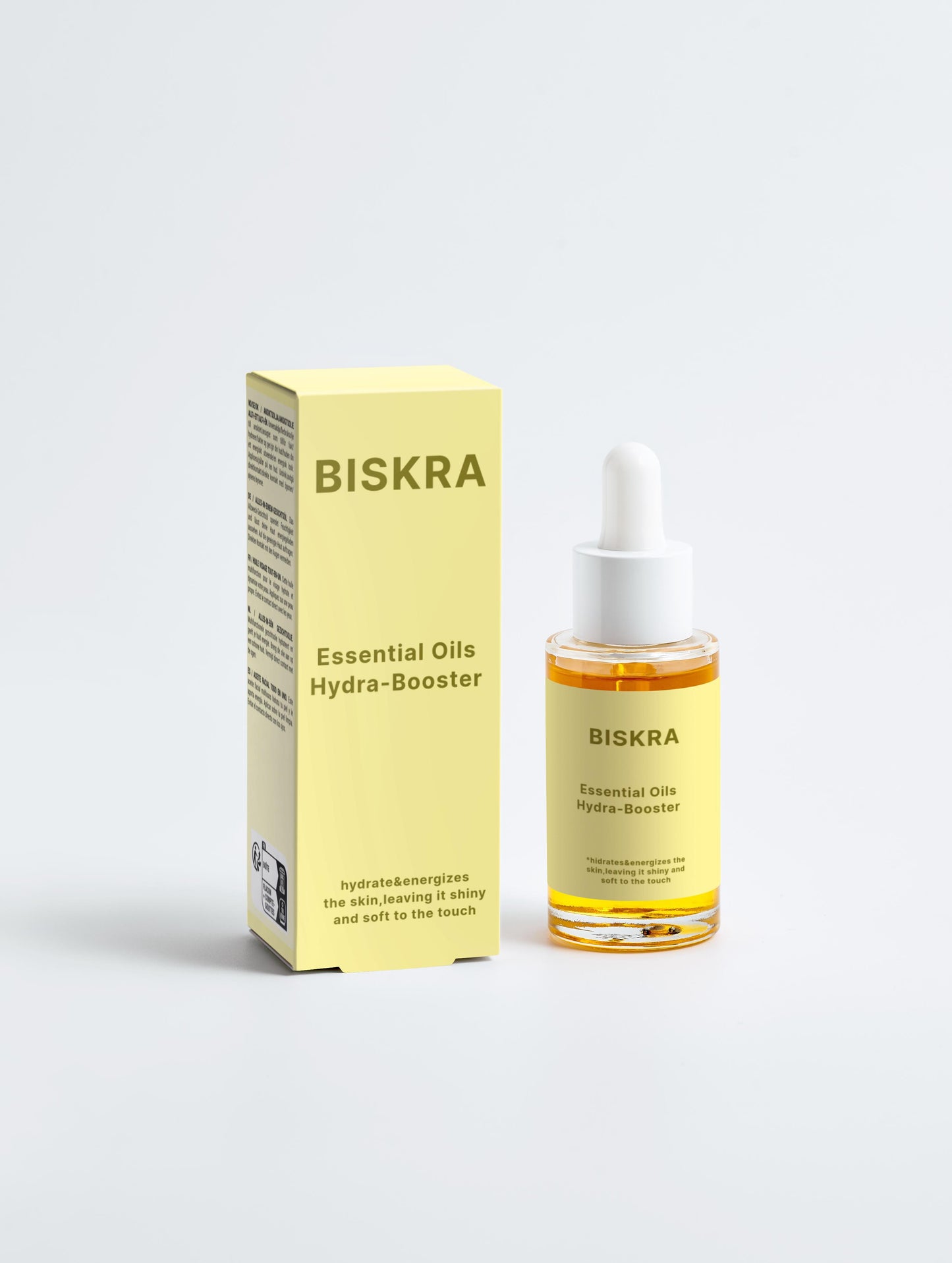BISKRA Hydra Booster bottle next to fresh botanical ingredients