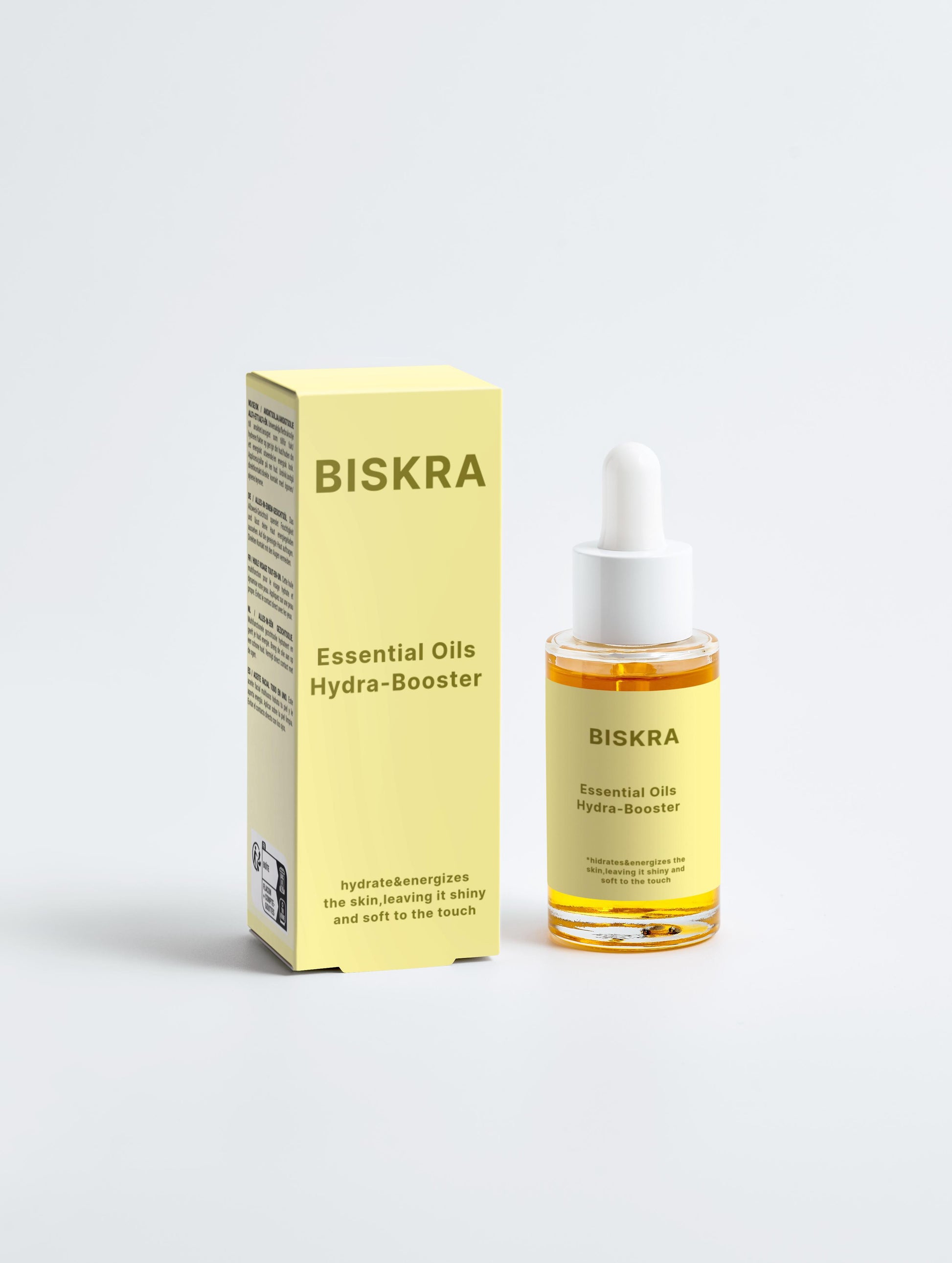 BISKRA Hydra Booster bottle next to fresh botanical ingredients