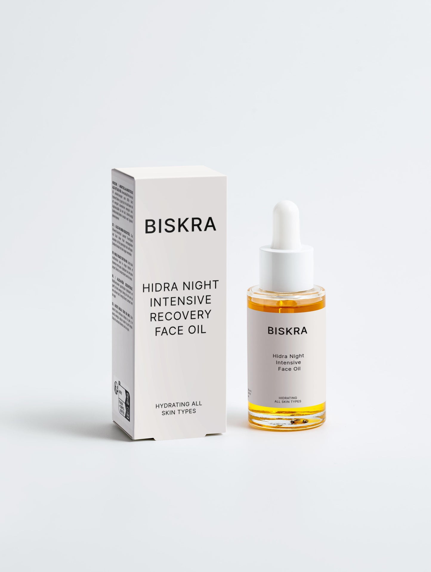 Glass bottle of Intensive Recovery Face Oil with golden-yellow serum inside