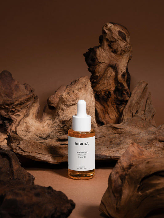 Intensive Recovery Face Oil with natural ingredients like jojoba, argan, and avocado oils displayed