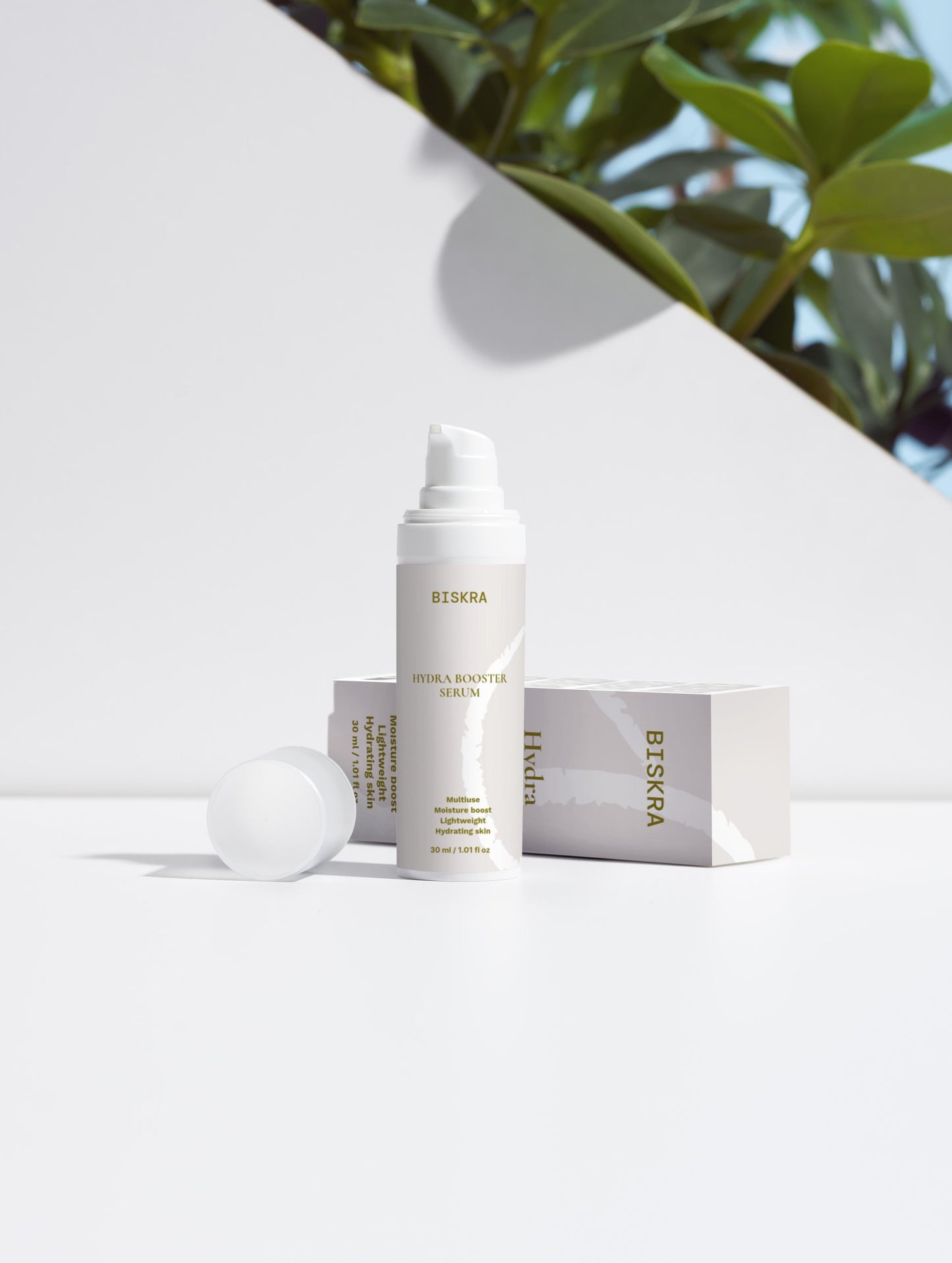 Luxurious Hydra Face Serum bottle surrounded by botanical ingredients