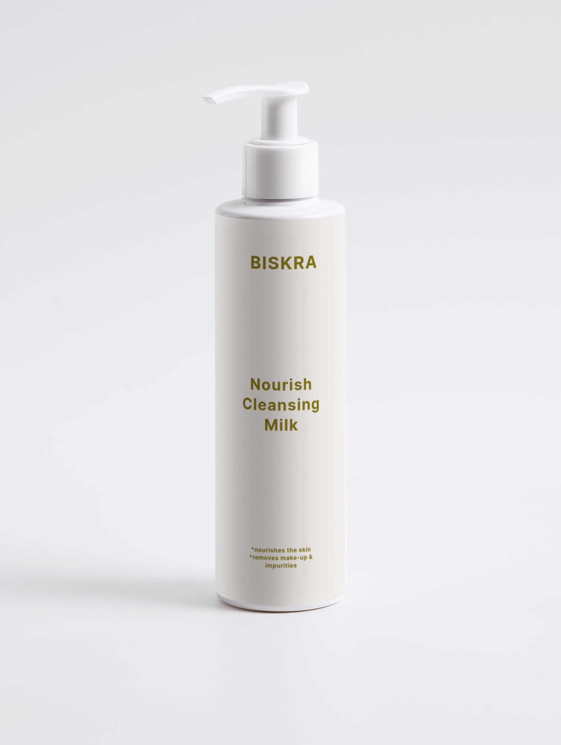 Texture close-up of silky cleansing milk on hand