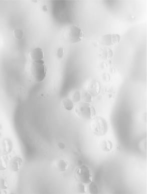 Close-up of frothy white liquid texture