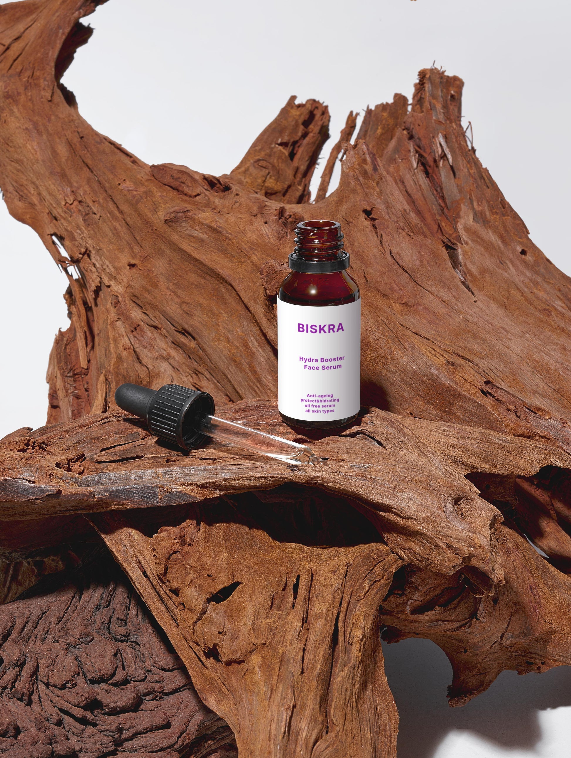 Bisikra dropper bottle with wooden surface